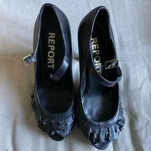 Report Ruffled, Peep-Toed Black Heels